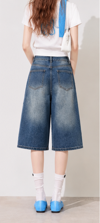 High-waisted wide-leg cropped jeans with a washed gradient effect